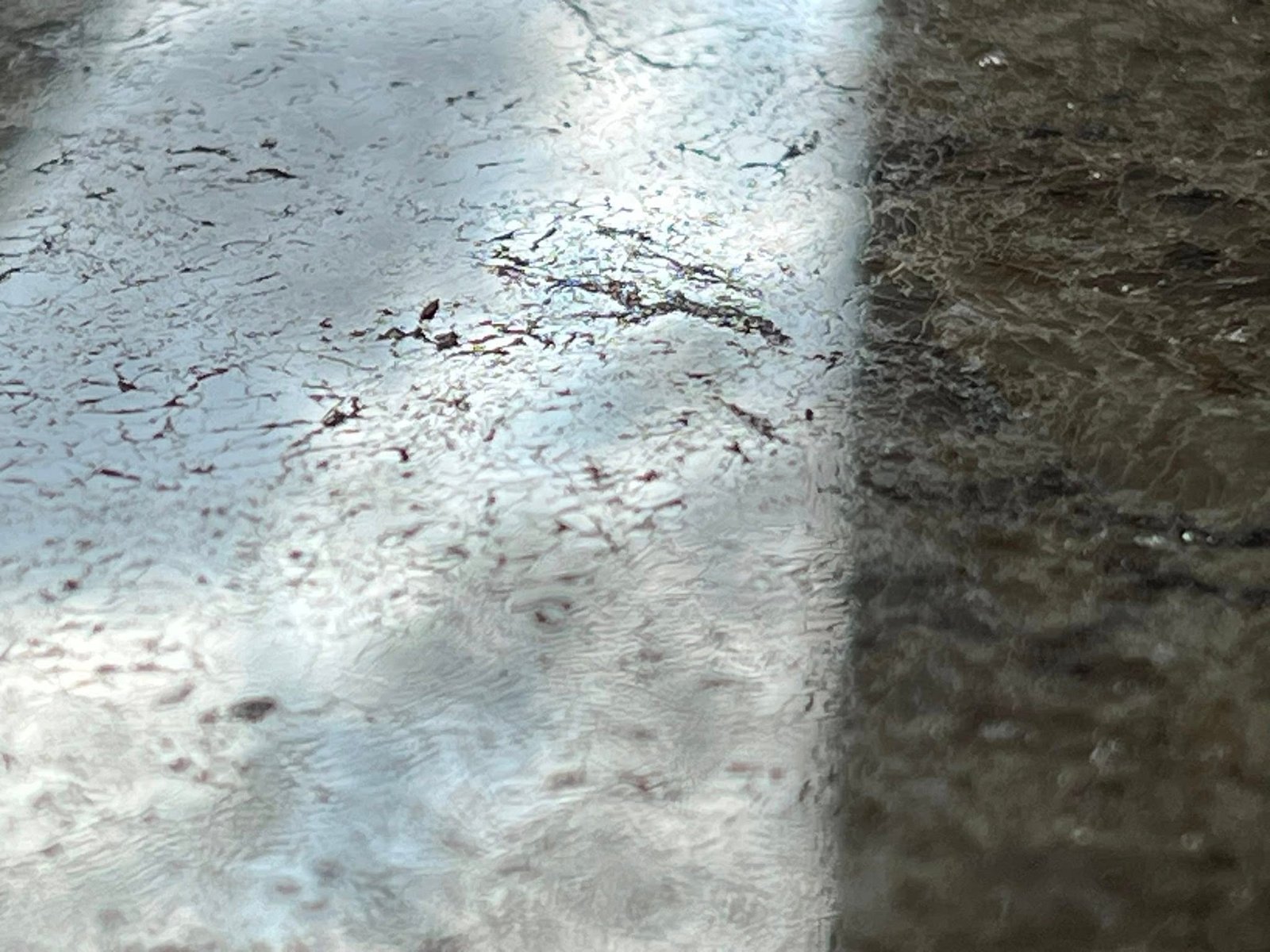Volcano and lava field against a stormy sky